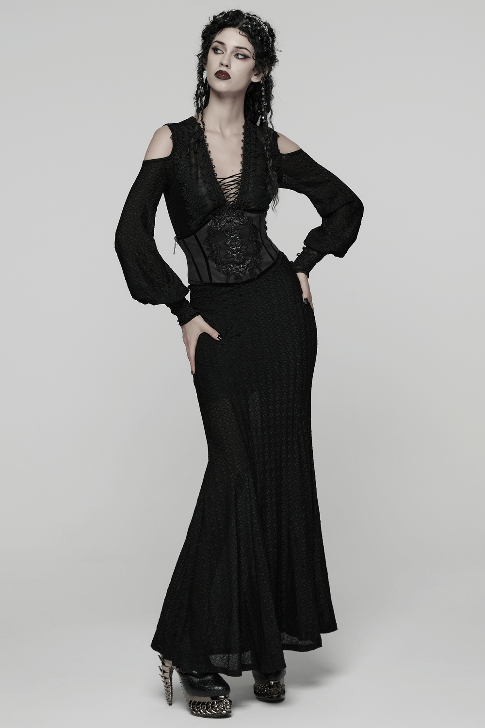 Women's Black Corset Belt with Embroidered Appliques worn over a black dress, showcasing gothic style and elegance.