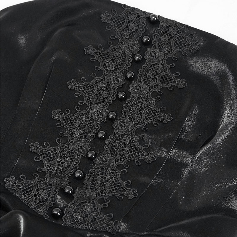 Close-up of black lace and button detailing on a women's Gothic slip dress, showcasing vintage elegance.