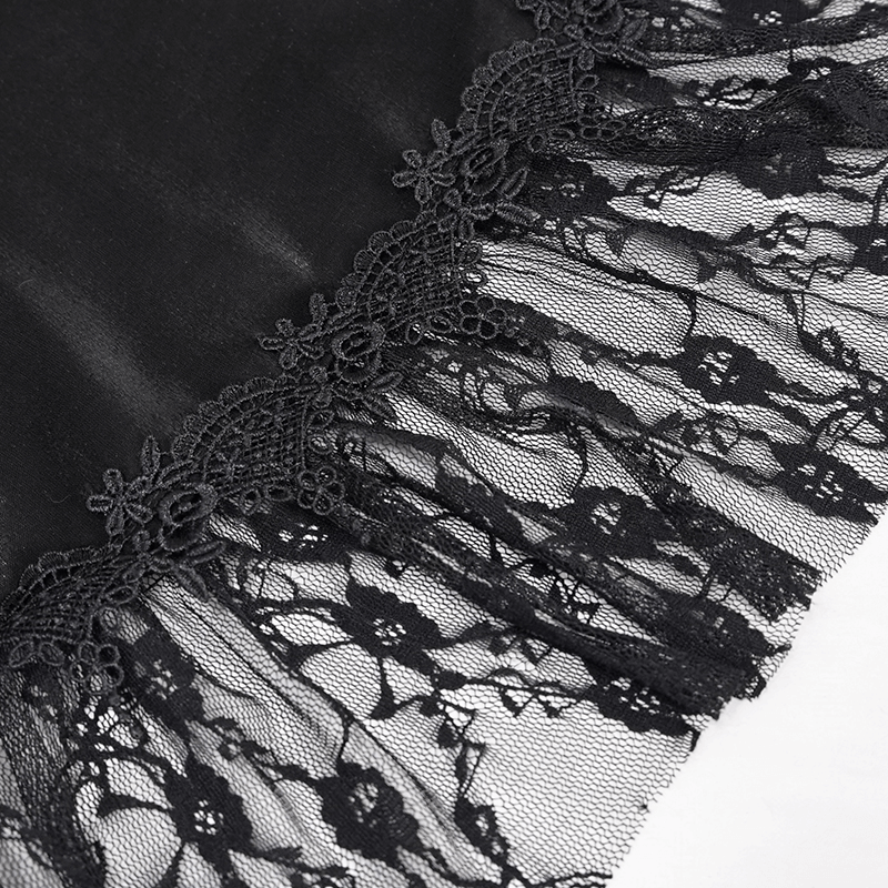 Close-up of black fabric with intricate lace trim, showcasing elegance and vintage gothic style.