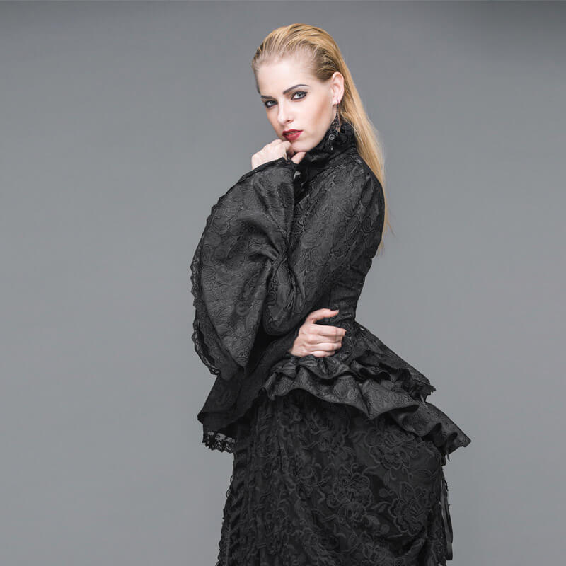 Women's gothic black shirt with high collar, ruffles, and flared sleeves, showcasing elegant vintage fashion.