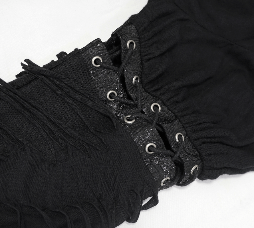 Close-up of the unique lacing detail on the sleeves of a women's black kimono short dress.