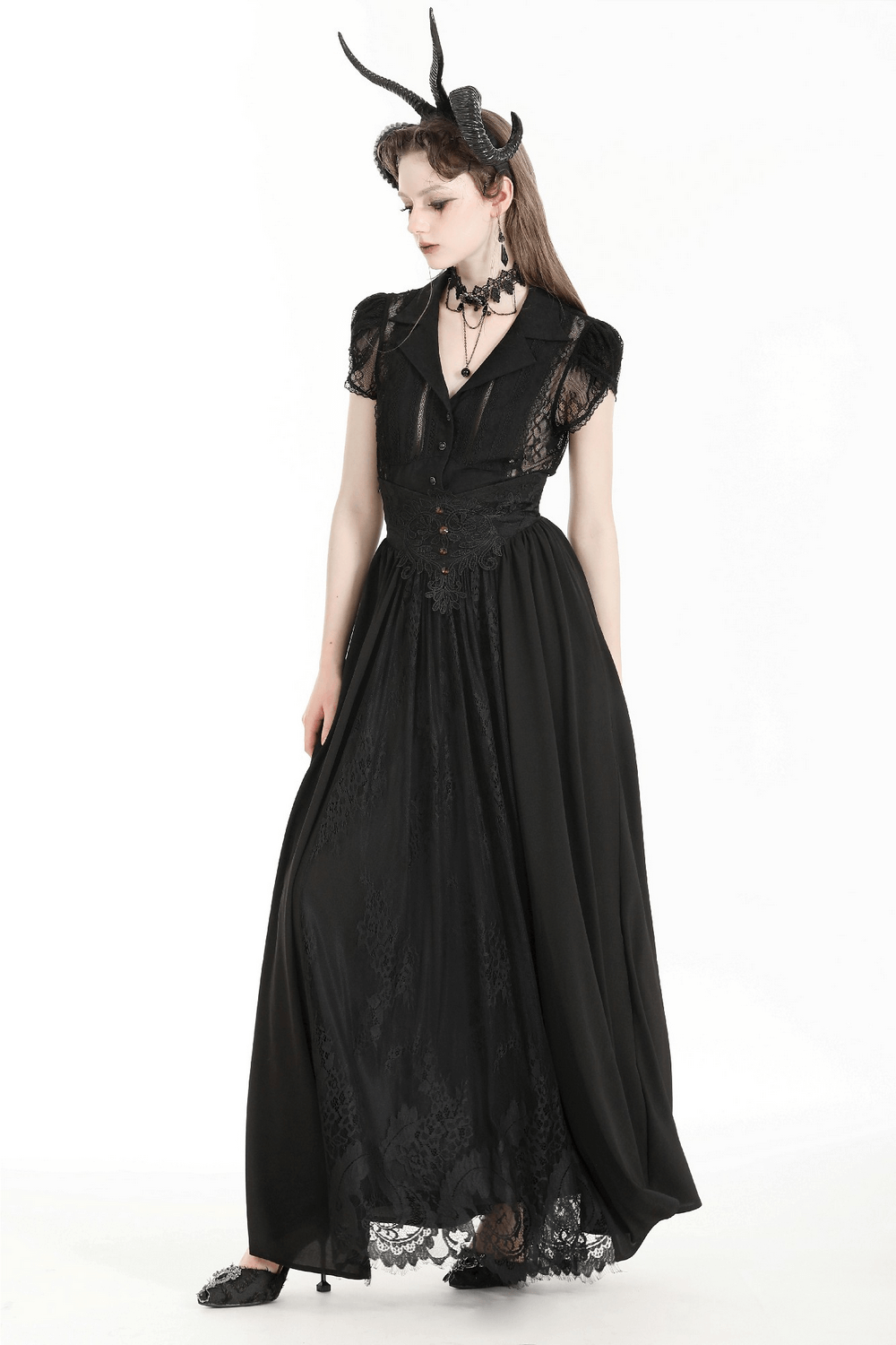 Gothic black lace blouse with puff sleeves, featuring intricate detailing and a dramatic, feminine silhouette.