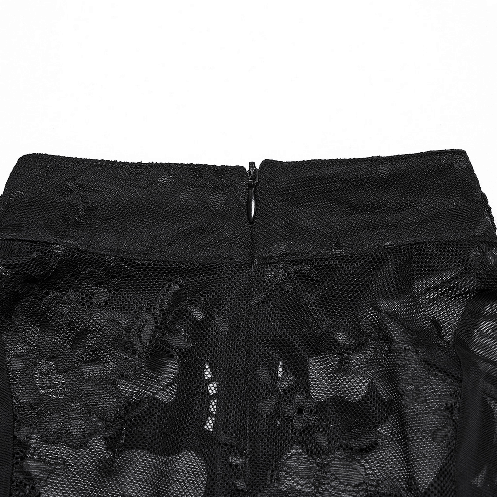 Back view of women's black lace ruffle top showing sheer lace detail and hidden zipper.