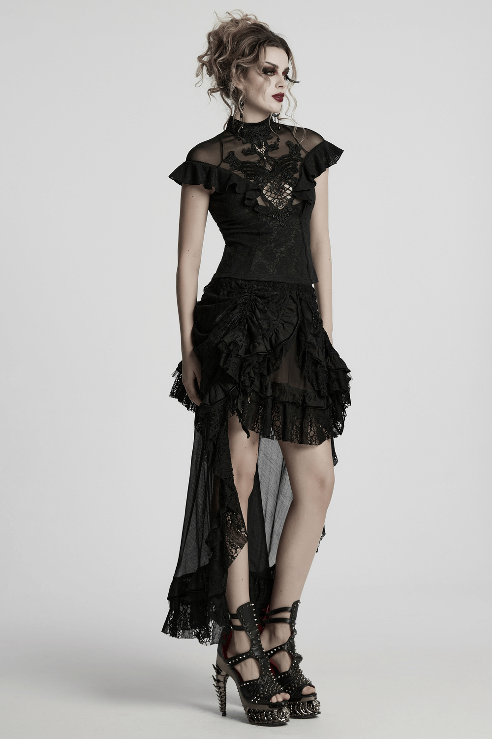 Women's black lace ruffle top with embroidered applique and sheer back detail for gothic fashion.