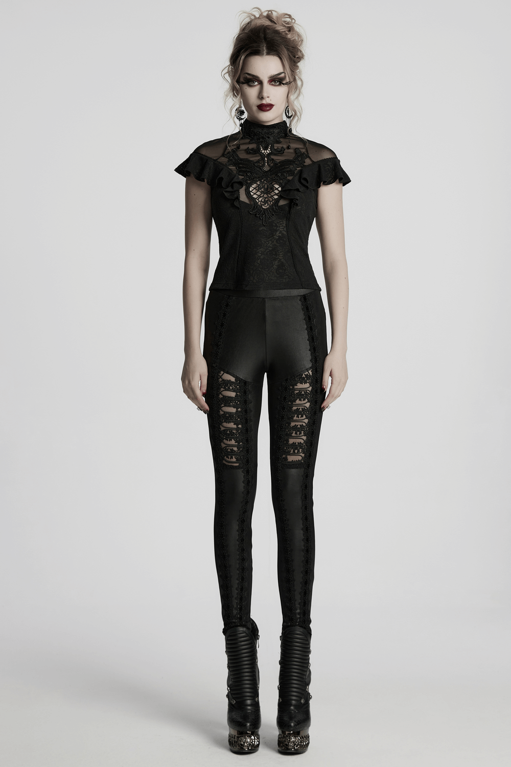 Gothic women's black lace ruffle top with sheer back detail and stylish fitted pants, perfect for dark romantic looks.