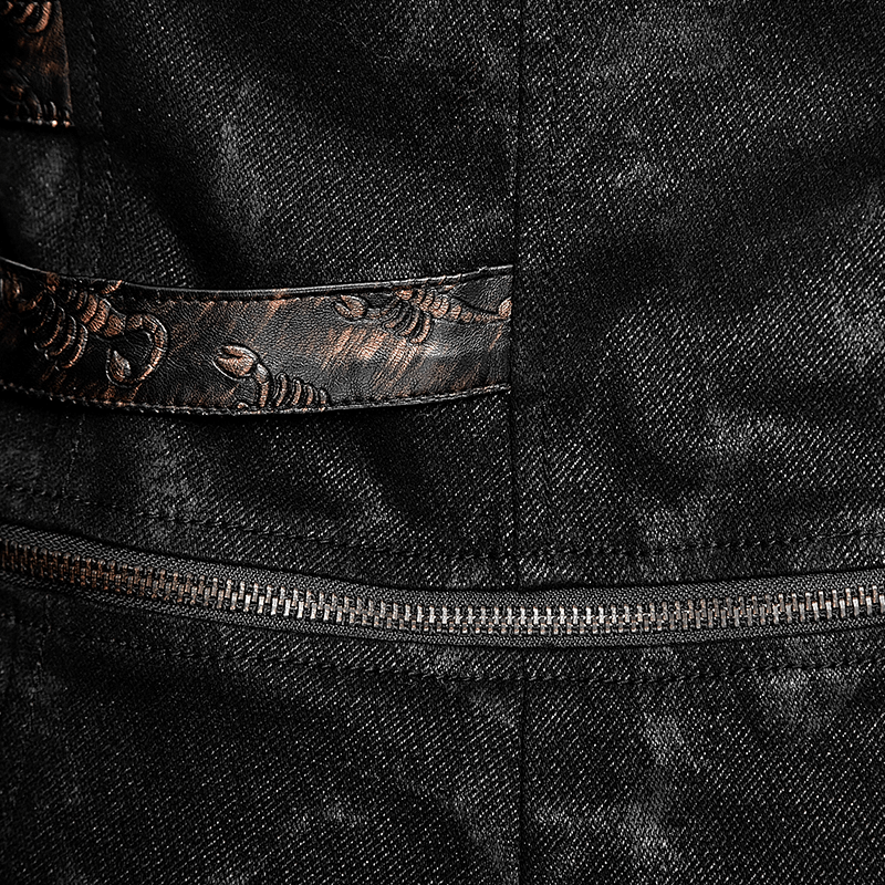 Close-up of black leather-look fabric with ornate silver accented detailing and zipper, perfect for gothic trench coats.