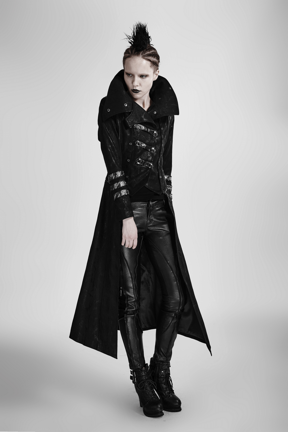 Gothic women's long black leather-look coat with oversized collar and silver accents, perfect for bold fashion statements.
