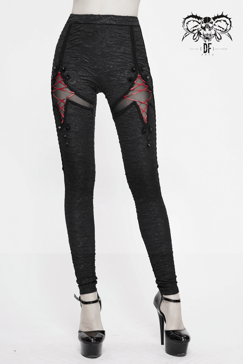 Women's black gothic leggings featuring red lacings and torn inserts, perfect for a trendy gothic outfit.