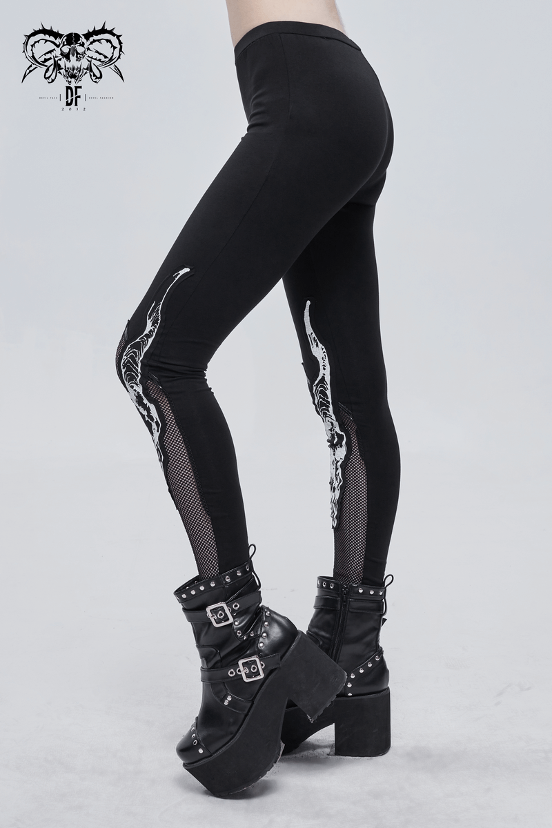Stylish women's black leggings with white Baphomet print and mesh insert, paired with edgy black platform boots.