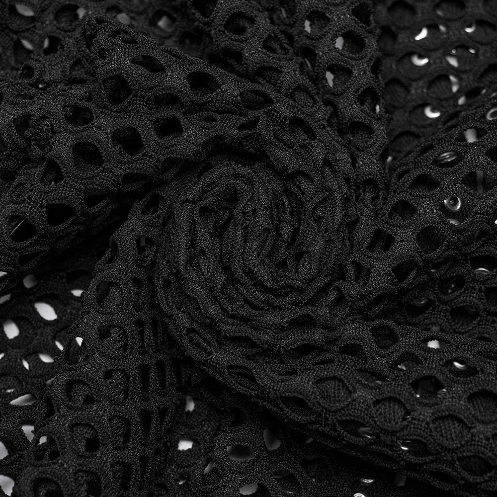 Close-up of black mesh fabric with a unique pattern, perfect for edgy fashion designs and layered outfits.