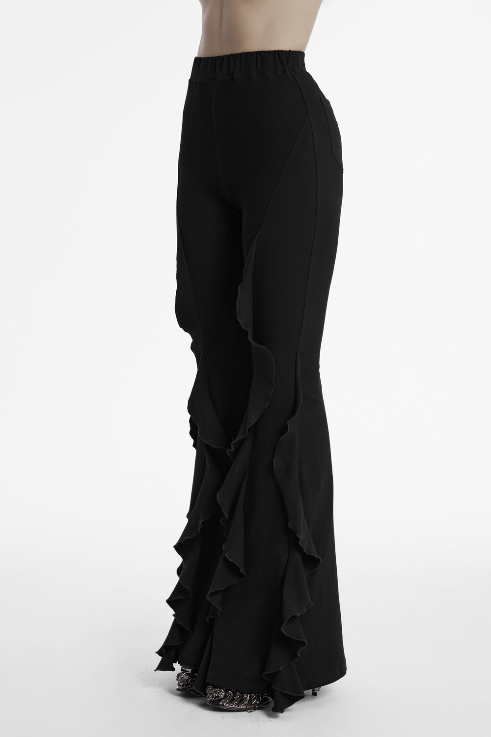 Women's black flare pants with dramatic ruffle trim, perfect for gothic style and edgy fashion.