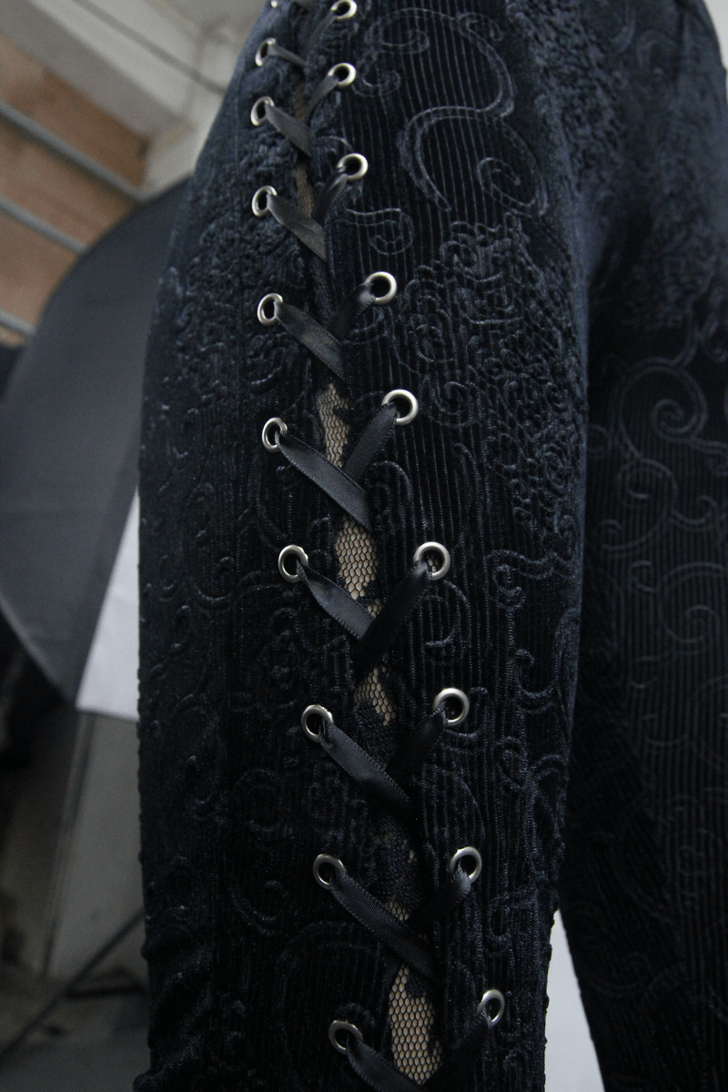 Close-up of women's black lace flare pants with intricate lace-up detail and elegant design, perfect for gothic style.