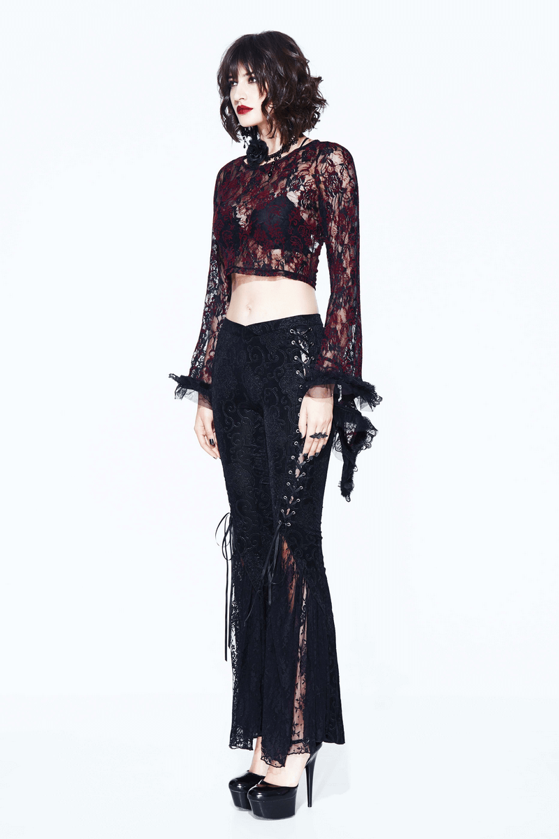 Model in black lace flare pants and a matching crop top, showcasing a gothic style look with elegant lace inserts.