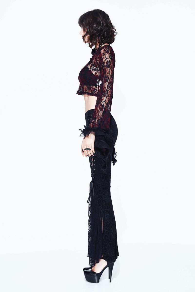 Side view of a model in black lace flare pants and a matching lace crop top, showcasing gothic vintage style.
