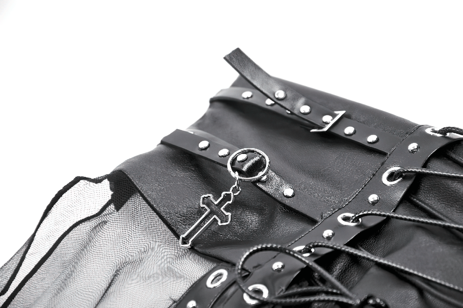 Close-up of gothic sheer maxi skirt's lace-up waist with metal stud and cross charm details.