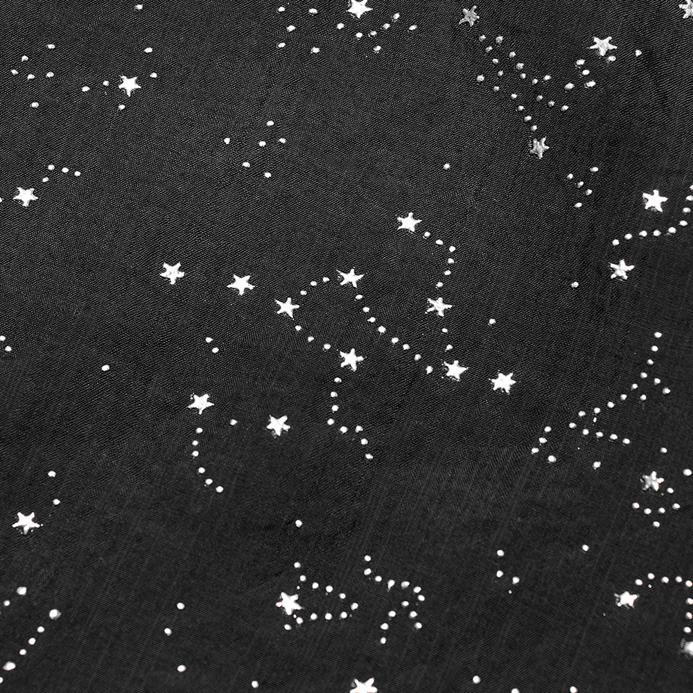 Close-up of black fabric with embossed silver stars, part of a celestial hooded cape design.