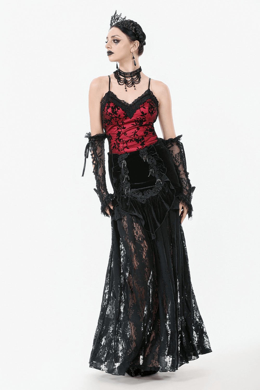 Gothic style model in black lace maxi skirt with corset back and red top, showcasing Victorian-inspired elegance.