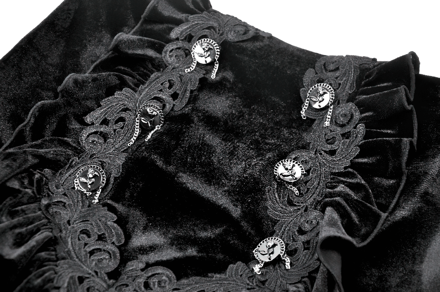 Close-up of black velvet fabric featuring ornate lace trim and decorative silver buttons for a gothic maxi skirt.