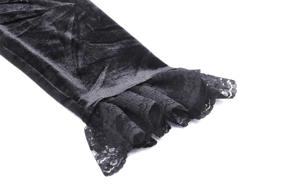 Close-up of black velvet dress sleeve featuring dramatic lace ruffle hem, showcasing luxurious gothic style.