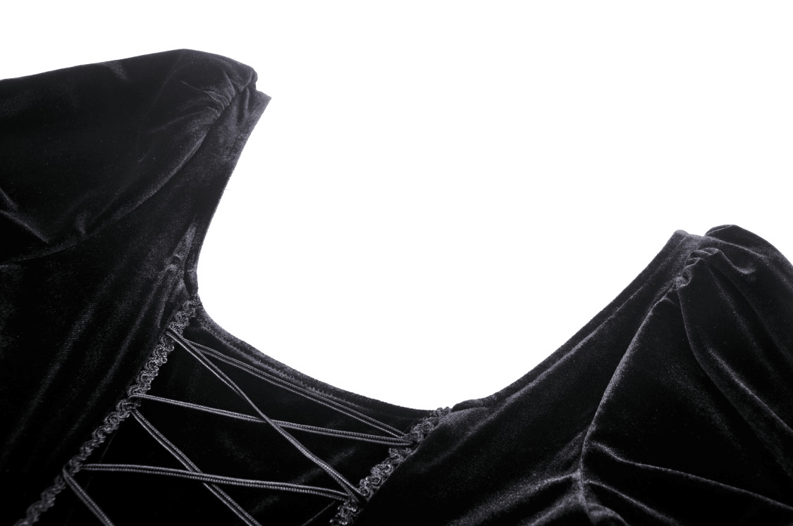 Close-up of the ruffled neckline and lace details on a women's black velvet gothic high-low dress.
