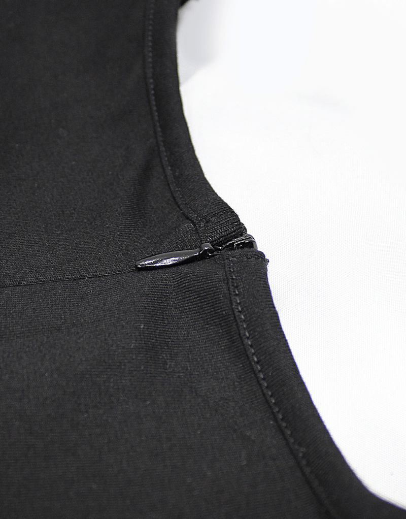 Close-up of the zipper detail on a women's black bodysuit with a sleek design.