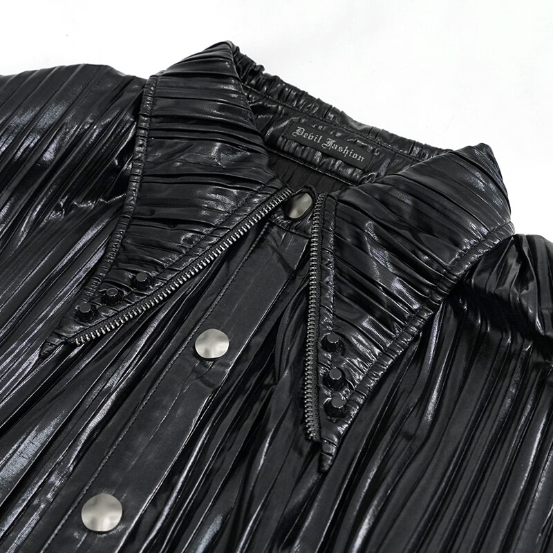 Close-up of a women's bright black pleated blouse with a retro design and pointed collar for cyberpunk style.