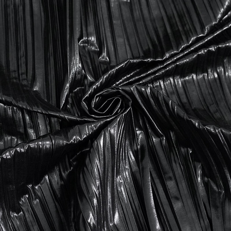 Close-up view of shiny black pleated fabric, perfect for a stylish cyberpunk blouse.