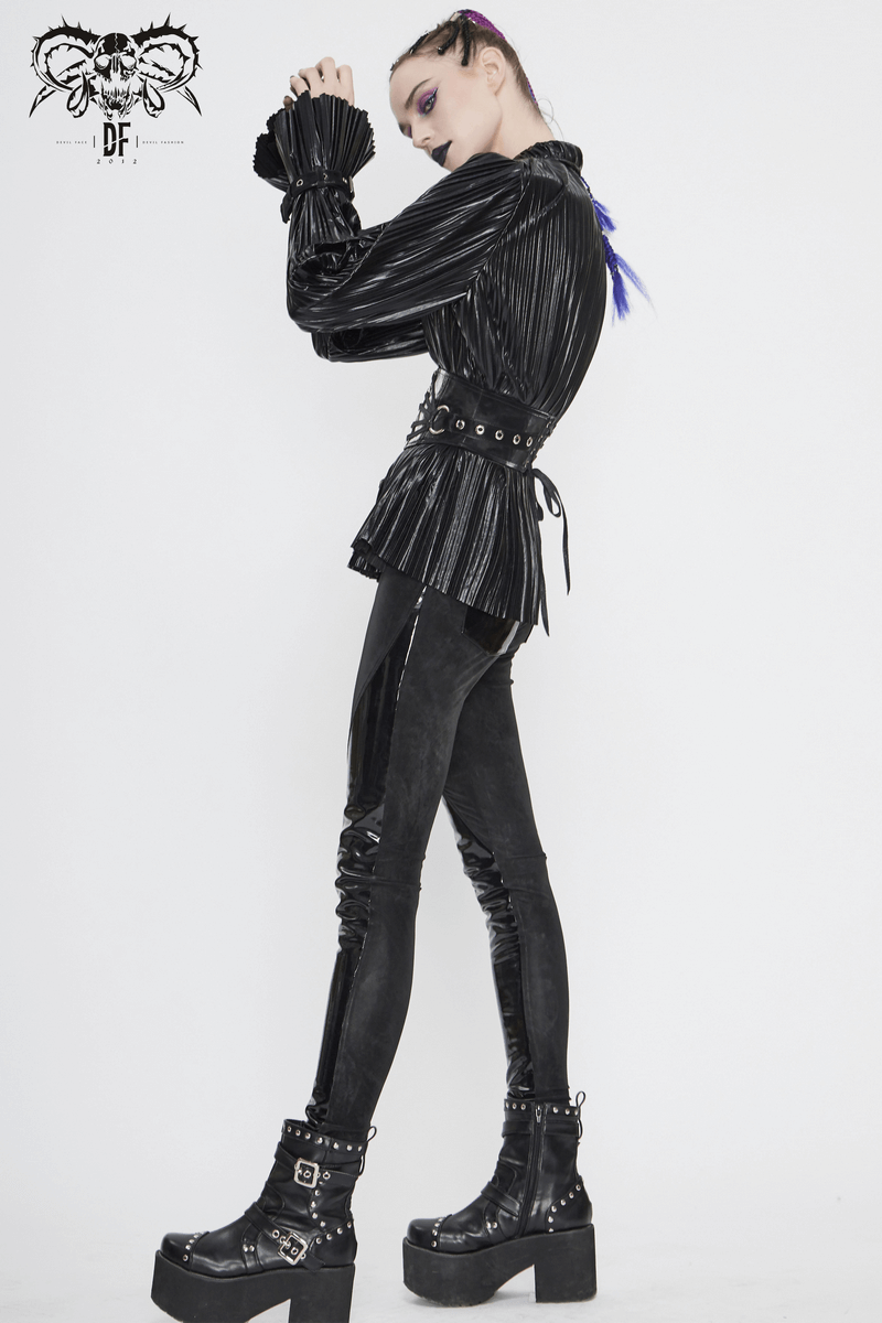 Stylish woman in a black pleated cyberpunk blouse and fitted leggings, showcasing a modern retro look with edgy boots.