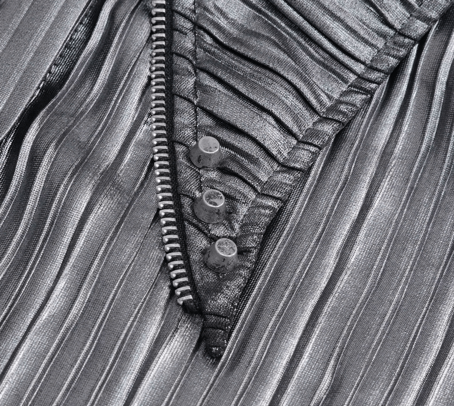 Close-up of women's silver shimmer blouse with ruffled fabric and button details for a stylish cyberpunk look.