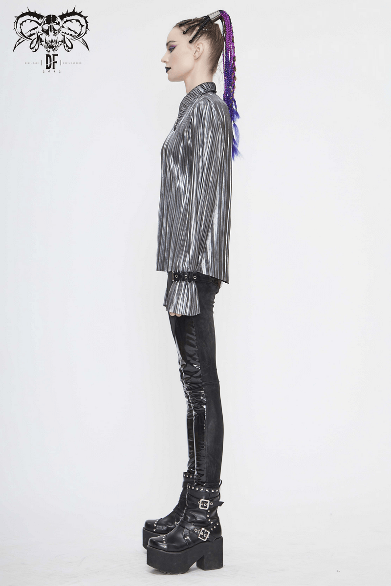 Side view of a model wearing a women's bright silver shimmer long ruffle sleeved blouse in a cyberpunk style.