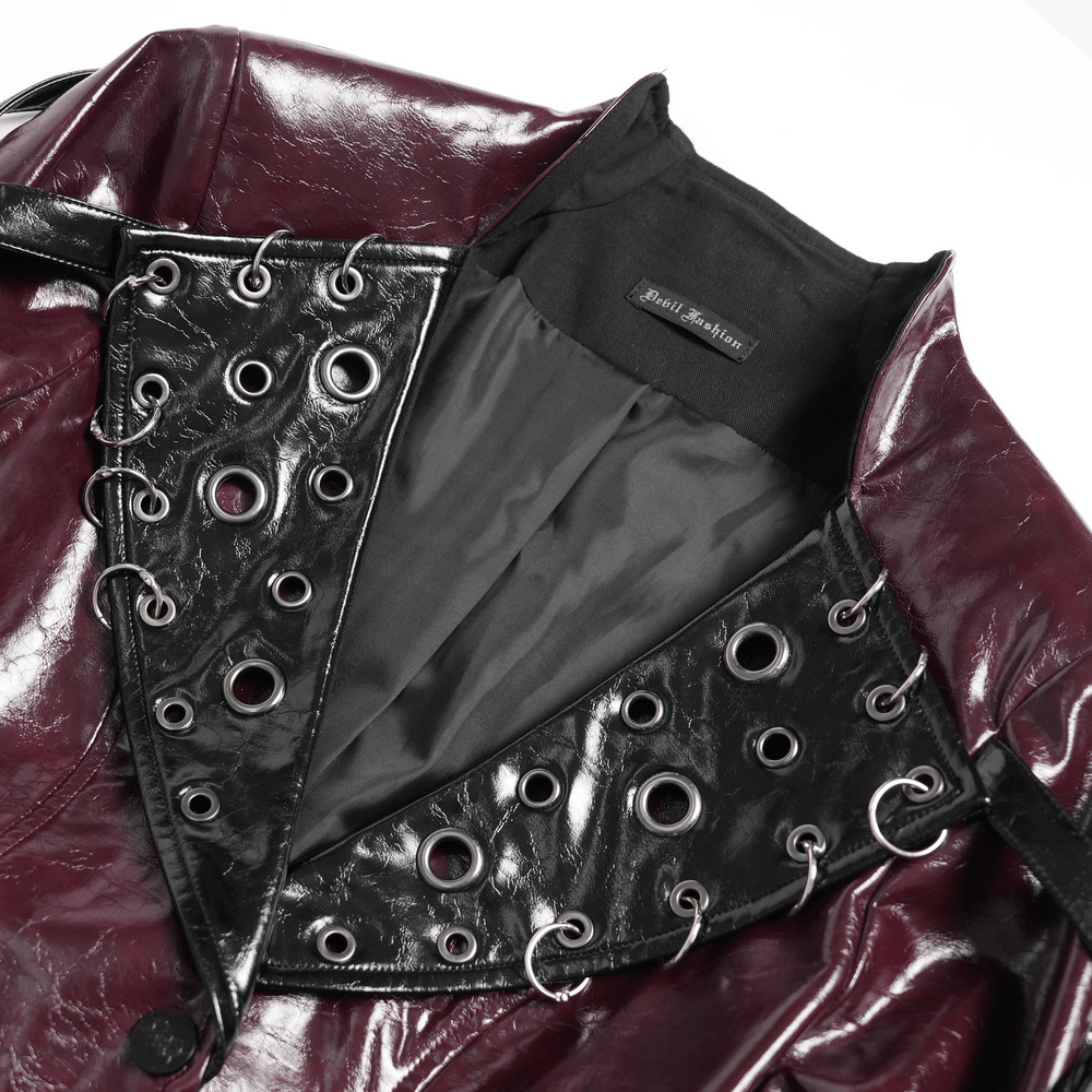 Women's Burgundy Faux Leather Harness Long Coat showcasing wide eyelet lapels and glossy faux leather finish.