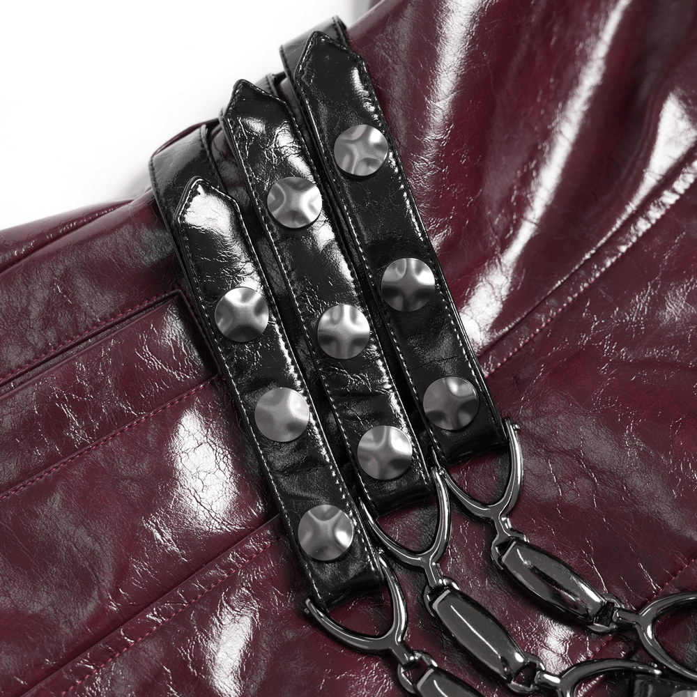 Detail view of Women's Burgundy Faux Leather Harness Long Coat showing glossy panels and buckle accents.
