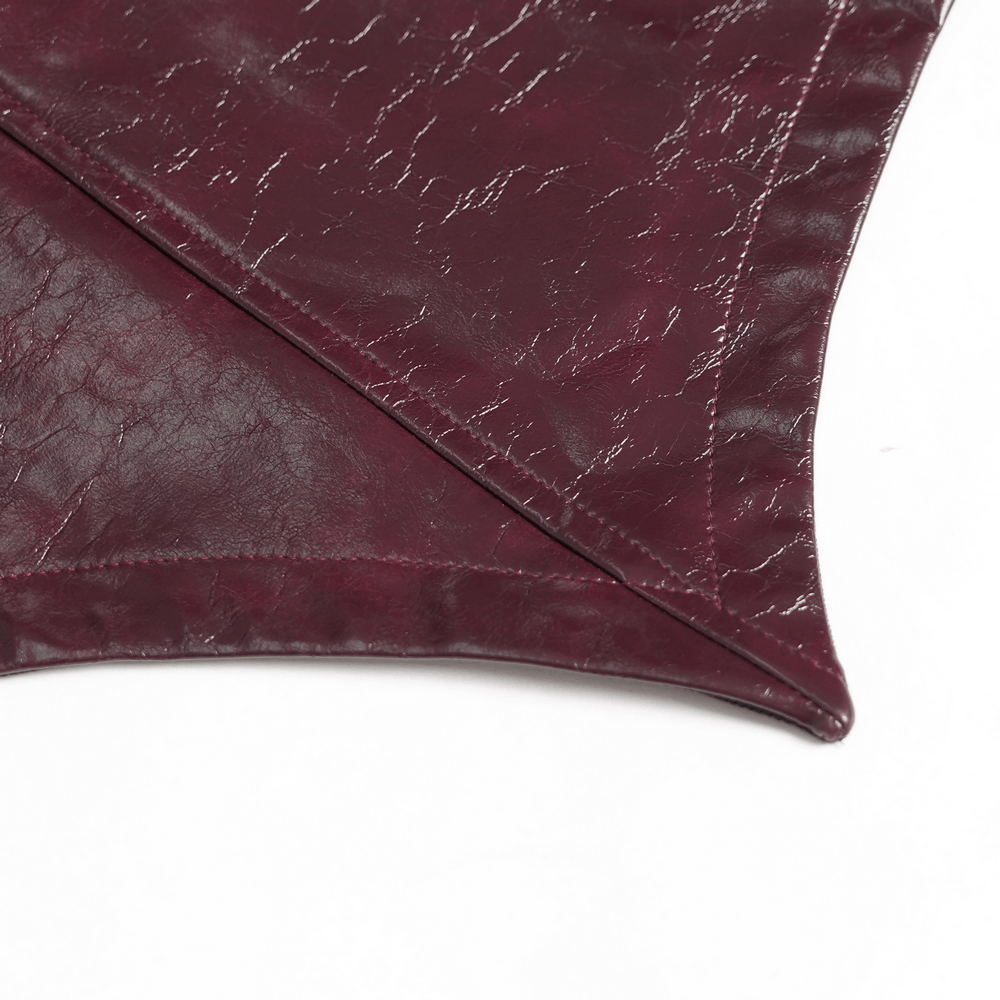 Detail of Women's Burgundy Faux Leather Harness Long Coat showcasing the glossy faux leather texture and pointed hem.