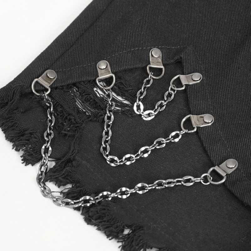 Close-up of women's punk shorts featuring edgy chain accents and frayed hem, perfect for a bold fashion statement.