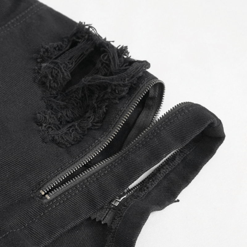 Close-up of women's punk style chains ripped shorts showing front zipper and edgy ripped details.