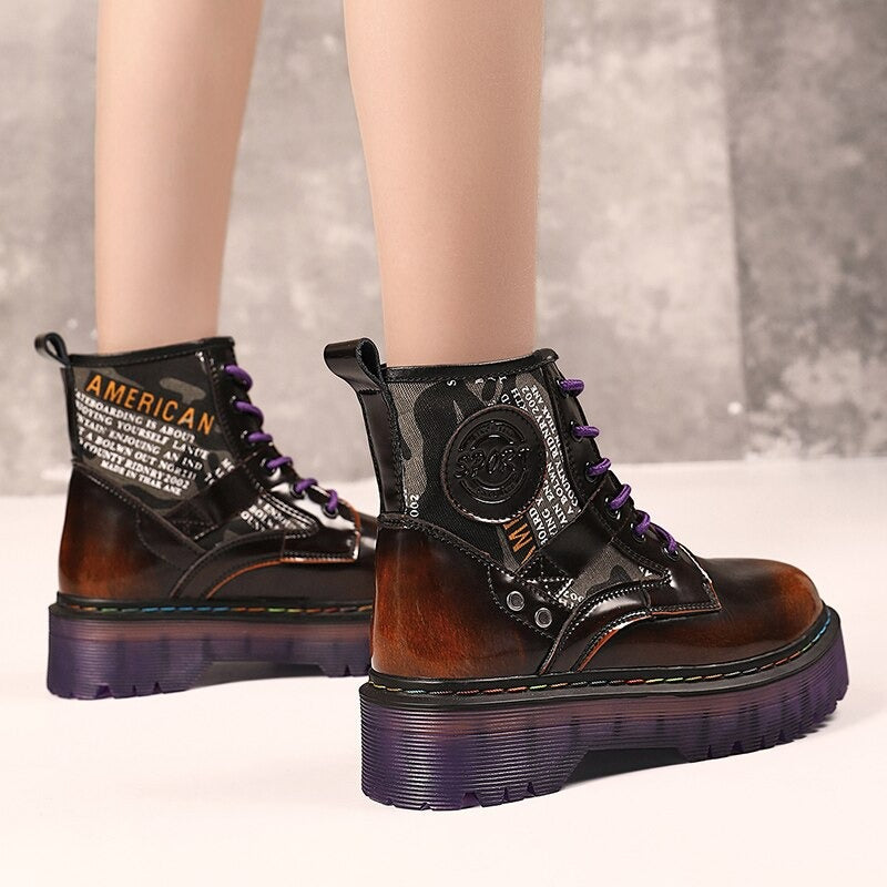 Women's chunky short boots with gradient colors and stylish patches, perfect for alternative fashion outfits.