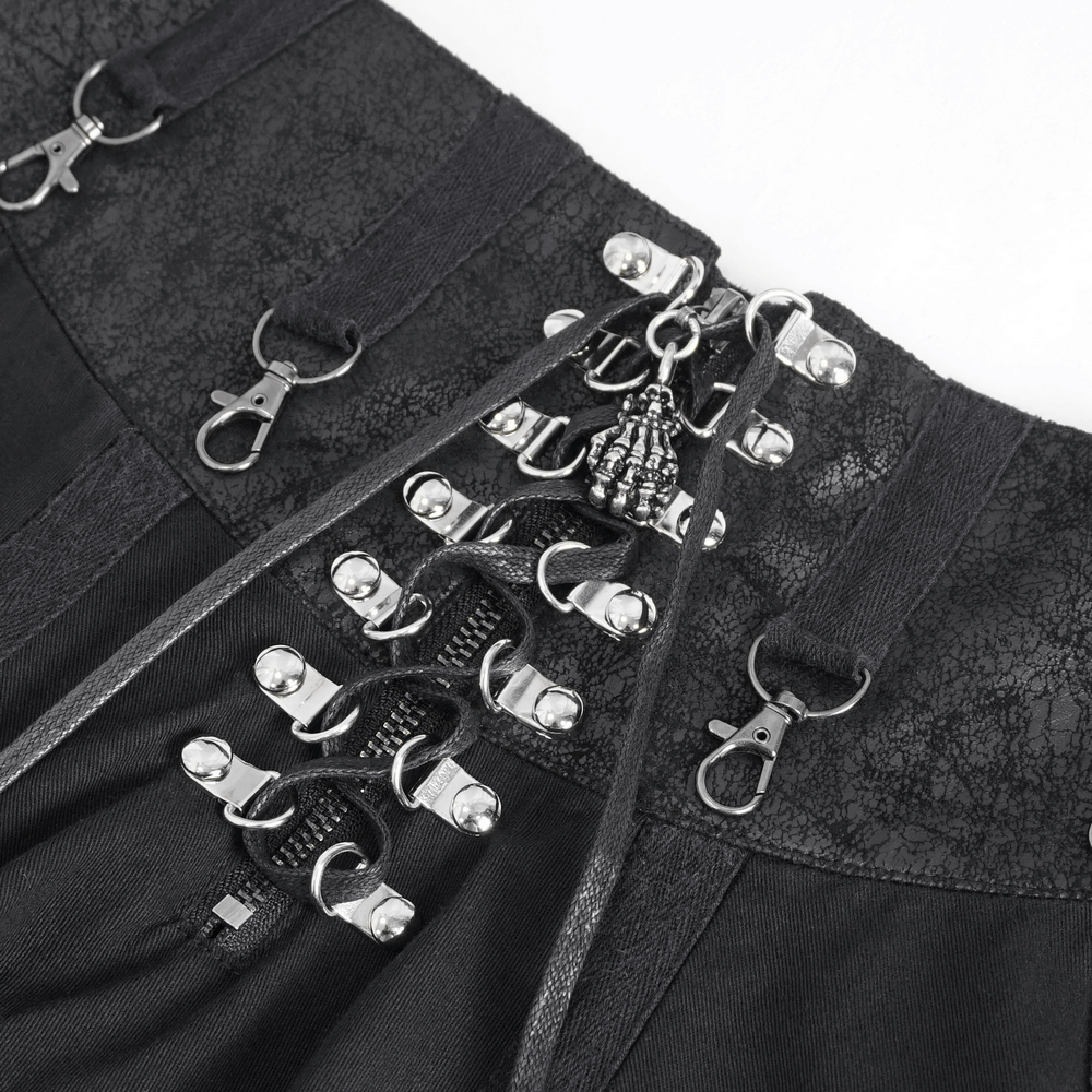 Close-up of steampunk black skirt lace-up design and metallic fasteners, showcasing high waist fashion details.