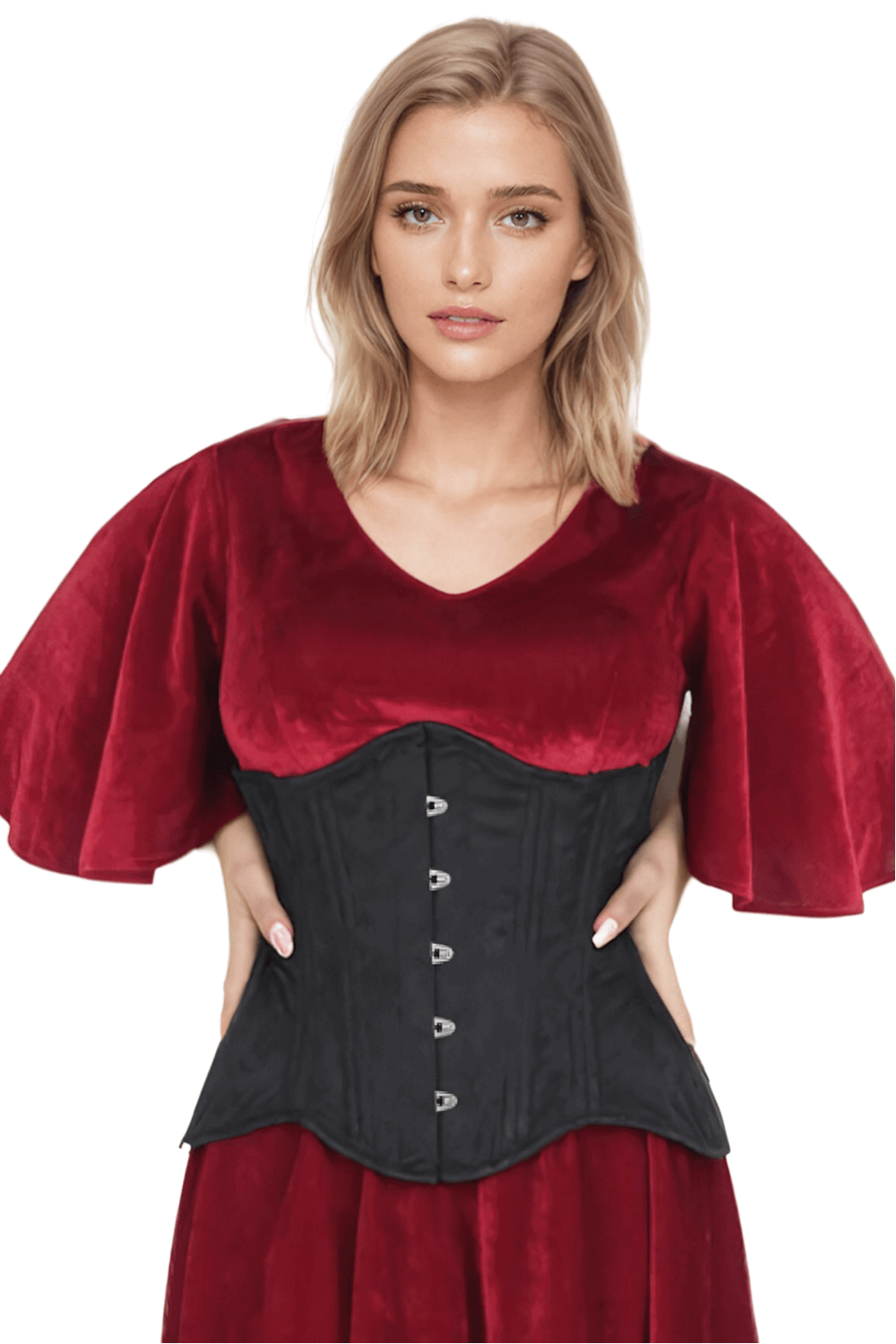 Woman modeling a black brocade waist trainer corset with a red velvet top, showcasing elegant curves and style.