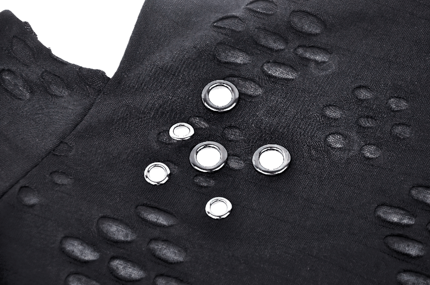 Close-up of black long sleeved top with unique cut-out details and metal studs, showcasing edgy punk-rock flair.