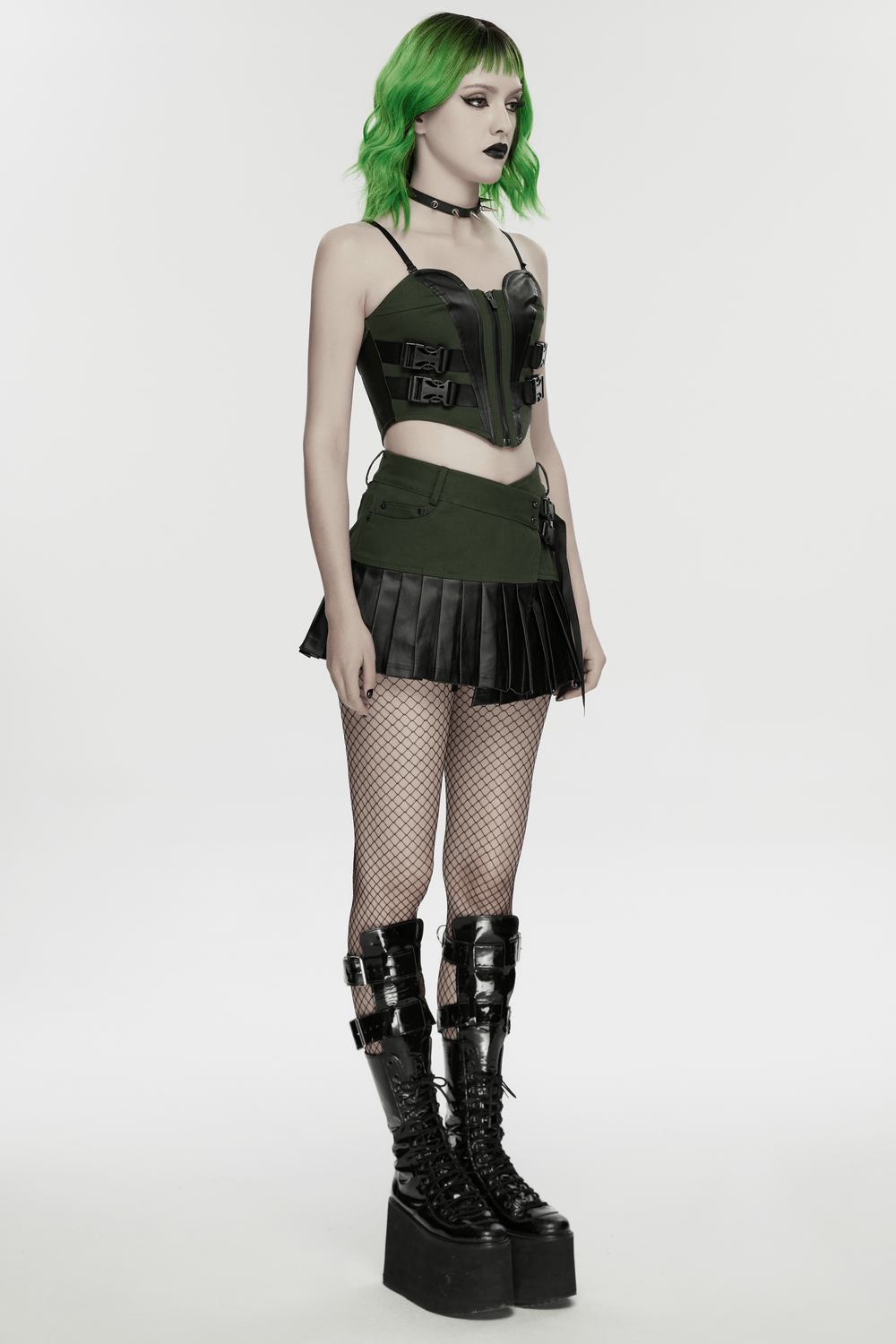 Women's Cyberpunk Buckle Bustier Corset Crop Top worn with a mini skirt and platform boots, showcasing bold streetwear style.