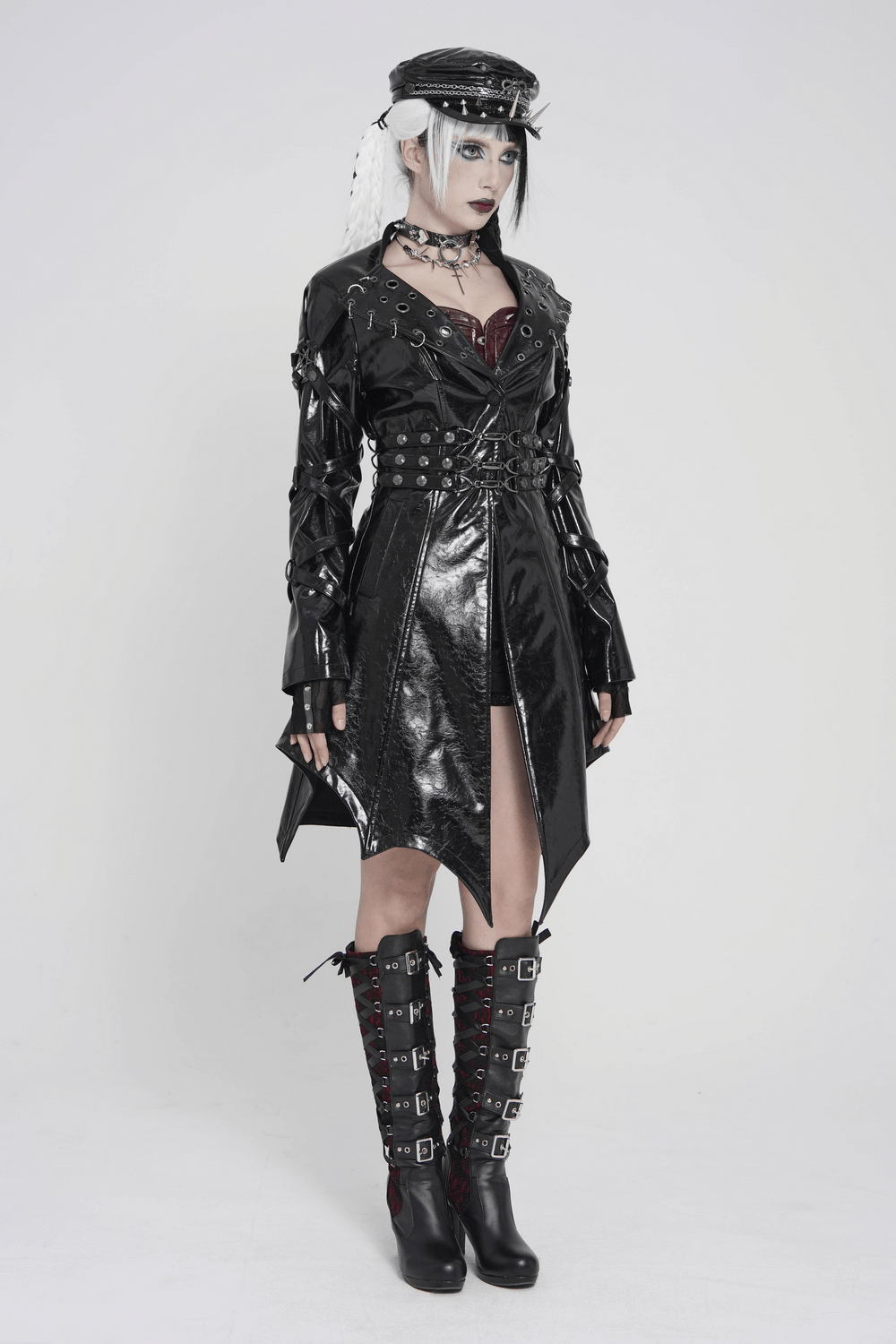 Women's Cyberpunk Patent Look Trench with Buckles worn by model in a dramatic pose showcasing buckled design and glossy finish.