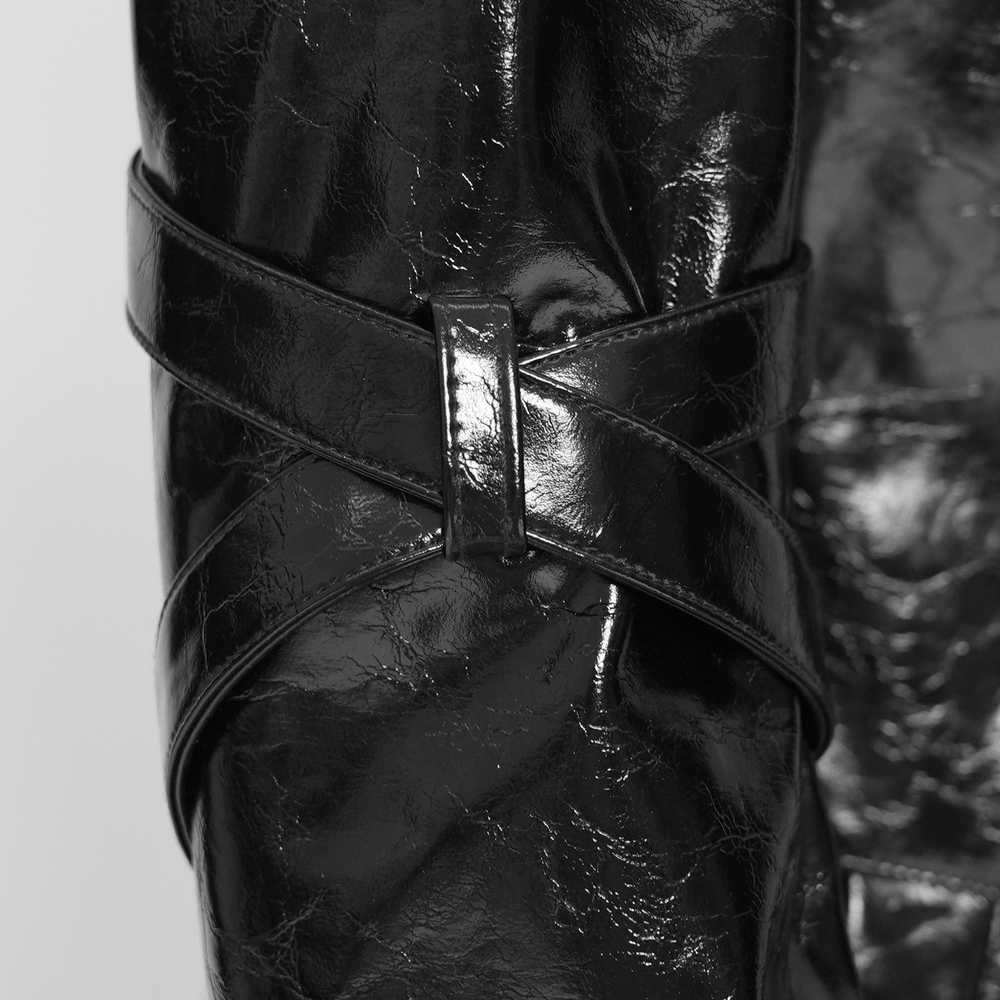 Detail of Women's Cyberpunk Patent Look Trench with Buckles showing the wrapped strap sleeve and glossy faux leather finish.