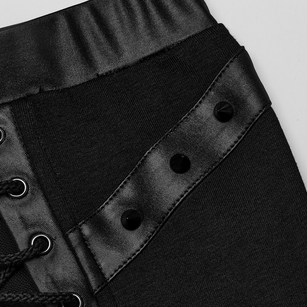 Close-up of the edgy mesh skirt showing satin drawstring and button details, highlighting punk fashion.