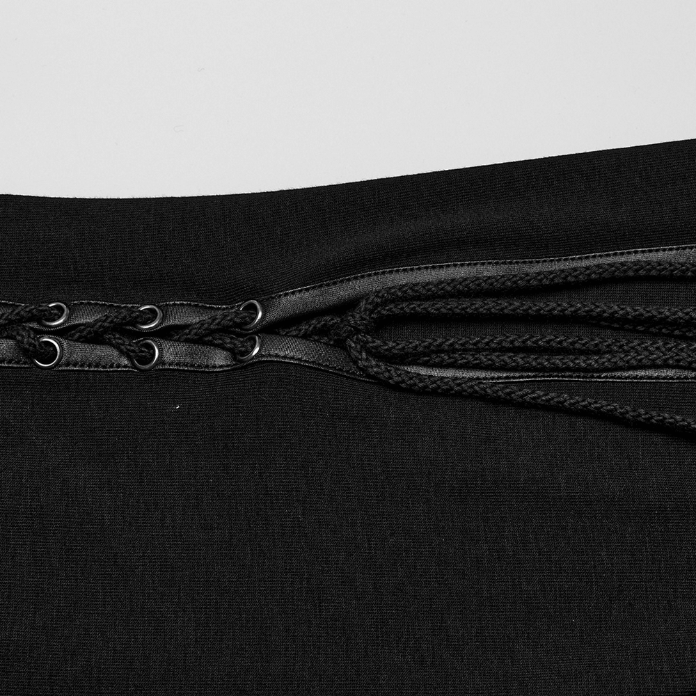 Close-up of edgy black skirt drawstrings and eyelets, showcasing punk style and sexy mesh details.