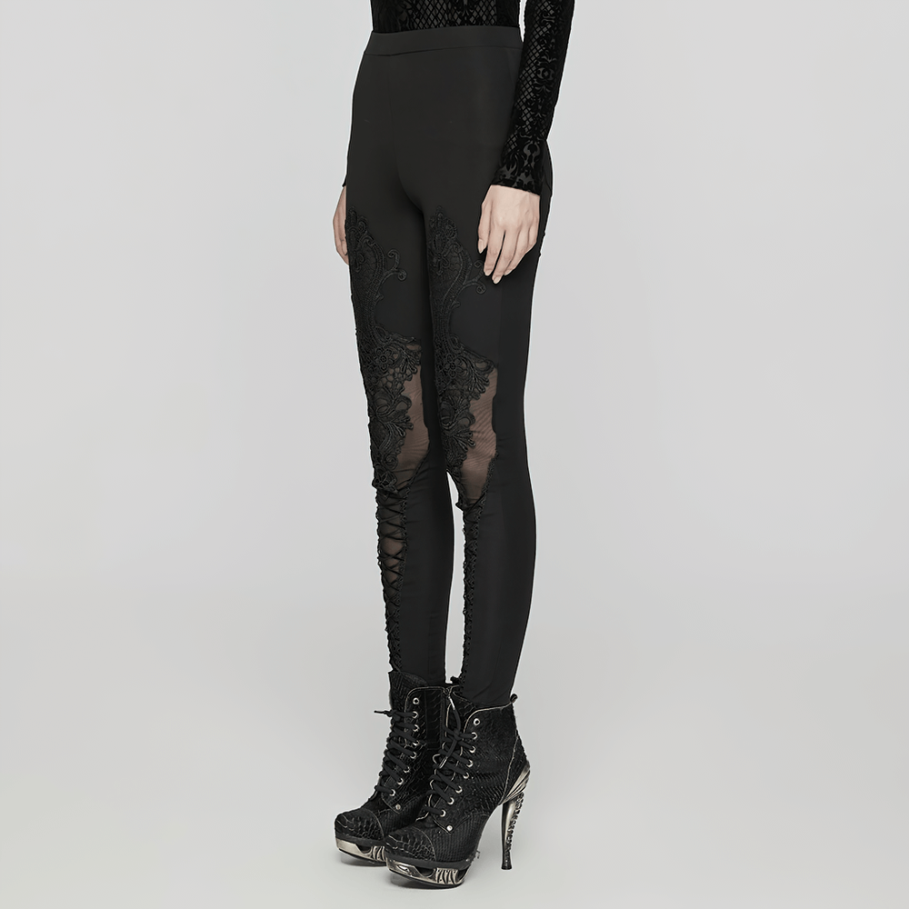 Women's black leggings with gothic lace decals, showcasing a stylish snug fit and decorative drawstrings.