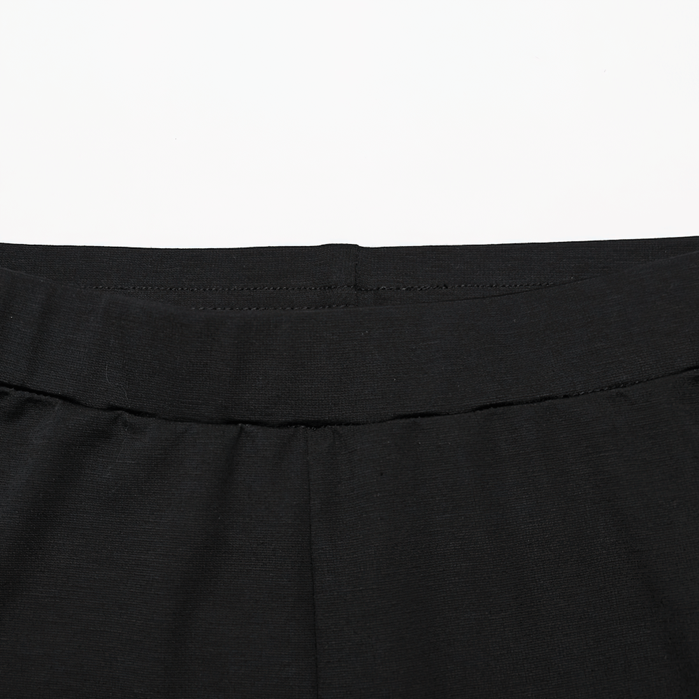 Close-up of women's black leggings waistband featuring stretchy fabric for comfort and a perfect fit.