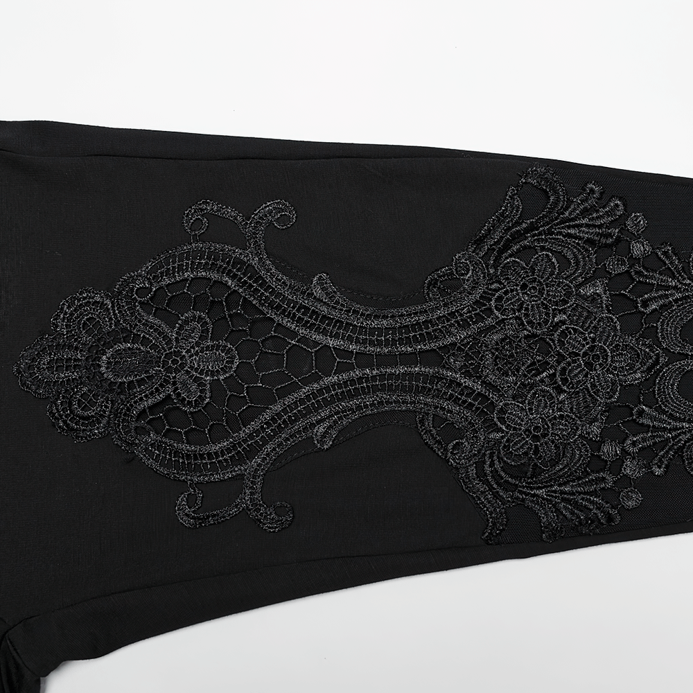 Close-up of lace decal detail on women's elastic black leggings, showcasing gothic floral design.
