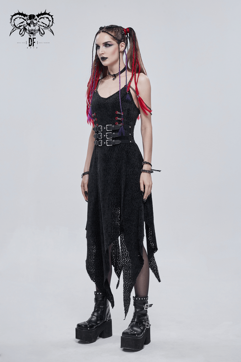 Punk-style woman wearing black belted dress with colorful hair and platform boots, showcasing edgy fashion.