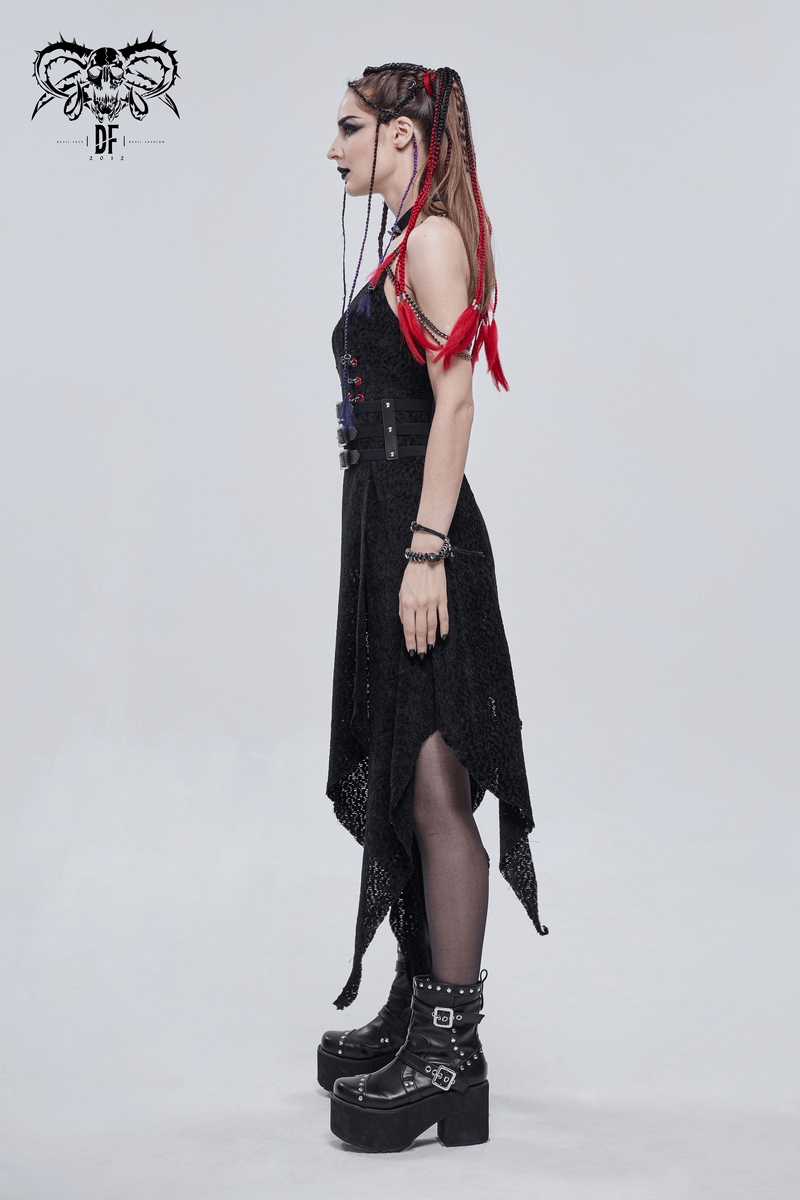 Side view of a model in a punk style outfit featuring a black dress and chunky platform boots.