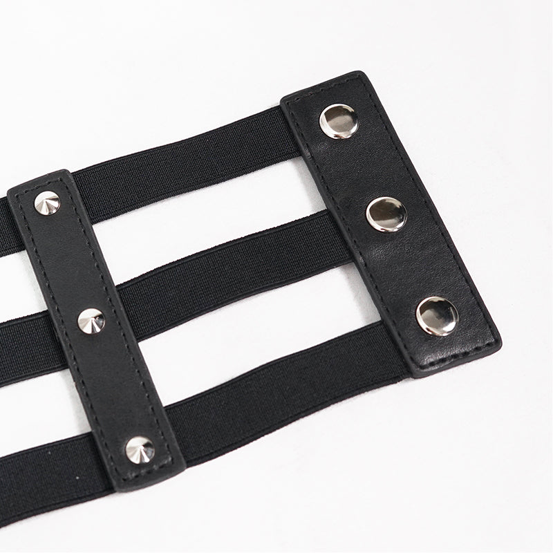 Close-up of women's punk style PU leather belt with rivets and adjustable straps.